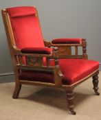 Edwardian oak armchair, moulded uprights, sides carved with swags, upholstered in red velvet,