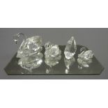 Four Swarovski crystal swans, various sizes, all boxed,