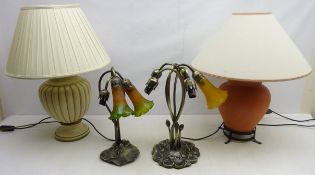 Two bronzed effect table lamps, lacking shades and two pottery table lamps,
