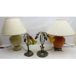 Two bronzed effect table lamps, lacking shades and two pottery table lamps,