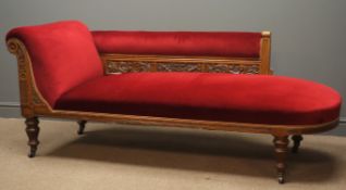 Edwardian oak chaise longue, back relief carved with scrolled foliage and flower heads,