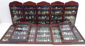 A large quantity of souvenir spoons in twelve display cases including; national trust, countries,