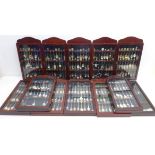 A large quantity of souvenir spoons in twelve display cases including; national trust, countries,