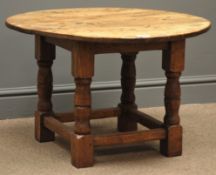 Circular country oak occasional table on joint base, turned supports connected by stretchers, D68cm,