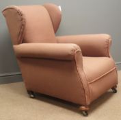 Early 20th century beech framed upholstered wing back armchair, turned feet, W88cm, H99cm,