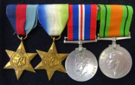 Four George VI medals; 1939-45 War medal and Defence medal,