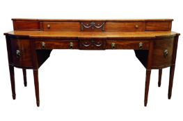 Regency mahogany sideboard, curved and canted break front top,