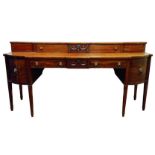 Regency mahogany sideboard, curved and canted break front top,