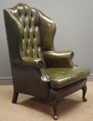 Georgian style wingback armchair, upholstered in buttoned green leather, with studded detailing,