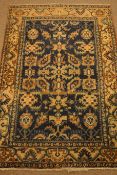 Persian blue ground rug, stylised design (205cm x 136cm),