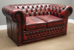 Two seat Chesterfield sofa upholstered in deeply buttoned ox blood leather, W157cm,