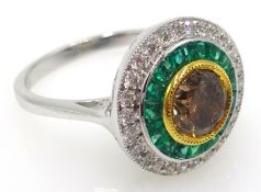 18ct white gold emerald, white and yellow diamond circular ring, stamped 750,