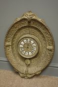 20th century French brass wall clock, white enamel numerals in embossed brass shield surround,