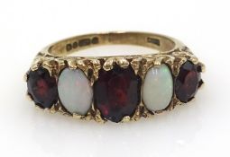 Five stone opal and garnet ring, hallmarked 9ct Condition Report Approx 4gm,