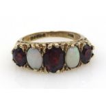 Five stone opal and garnet ring, hallmarked 9ct Condition Report Approx 4gm,