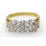 Three stone diamond gold ring (tested 18ct), diamonds 0.