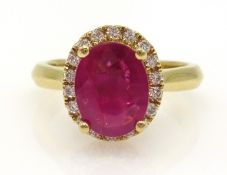 18ct gold oval ruby and diamond cluster ring, hallmarked, ruby approx 1.