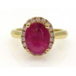 18ct gold oval ruby and diamond cluster ring, hallmarked, ruby approx 1.