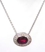 White gold rub-over oval ruby and diamond, cluster pendant necklace stamped 18K, ruby approx 1.