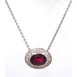 White gold rub-over oval ruby and diamond, cluster pendant necklace stamped 18K, ruby approx 1.