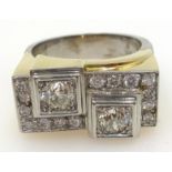 18ct white and yellow gold diamond geometric ring, set with two old cut diamonds of approx 1 carat,