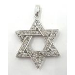 18ct white gold diamond Star of David pendant stamped K18 diameter 2.