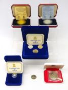 Isle of Man cased set of three Manx one pound coins, two other Manx one pound coins,