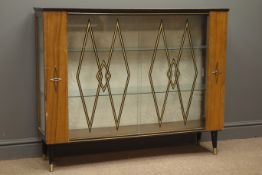 Mid 20th century display cabinet enclosed by sliding glass door with black and gold lozenge