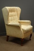Wingback armchair upholstered in floral patter fabric Condition Report <a