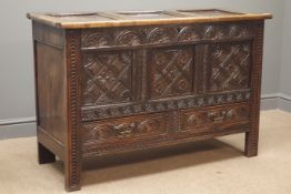 18th century heavily carved oak mule chest, panelled lid, lunette and chip carved front,