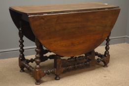 Early 20th century oak drop leaf table, gate action base, bobbin turned supports and stretchers,