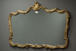 Ornate cast gilt metal scroll framed mirror, W100cm, H69cm,