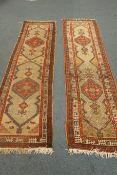 Two Persian runner rugs, Herati motif, beige ground, red border,