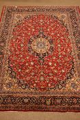 Persian Meshed red ground rug carpet, pointed medallion with rosette,