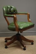 20th century regency style swivel armchair, upholstered in buttoned green leather,