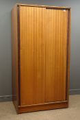 Mid 20th century retro single wardrobe with sliding doors enclosing hanging rail and five shelves,