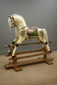 19th century Dapple Grey painted rocking horse, fitted bridle, saddle and stirrups, trestle base,