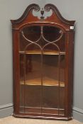 Late 19th century mahogany wall hanging corner cabinet, raised swan neck pediment,