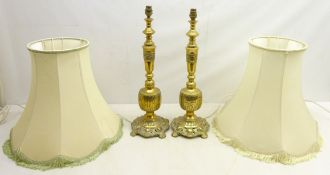 Pair cast brass table lamps with pierced bases and bands of Hieroglyphic style decoration,