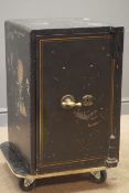 Early 20th century cast iron safe, with key, W41cm, H61cm,