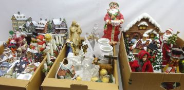 Large collection of Christmas ornaments and decorations including various Santa figures,