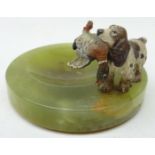 Green onyx circular ashtray mounted with a cold painted bronze figure of a gun dog carrying game