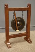 'Mouseman' pegged oak gong stand, painted circular gong, stepped sledge supports,