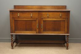 Early 20th century oak sideboard, raised back, two drawers, above cupboard enclosing a shelf,