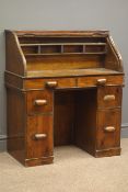 Mid 20th century small pine pedestal tambour roll top desk, fitted interior, six drawers, W77cm,