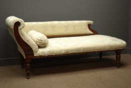 Edwardian walnut framed chaise longue, carved with scrolled flowers and foliage,