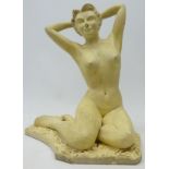 Cream painted figure of a seated nude, signed 'Howes April 56',