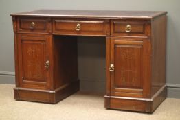 Edwardian walnut twin pedestal desk, leather top inset, three drawers and two panelled cupboards,