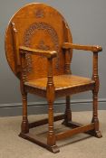 Early 20th century medium oak monks chair, guilloche carved back and rails,