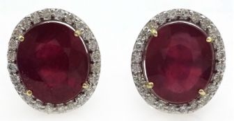 Pair of 18ct white gold ruby and diamond cluster stud ear-rings, rubies stamped 750,